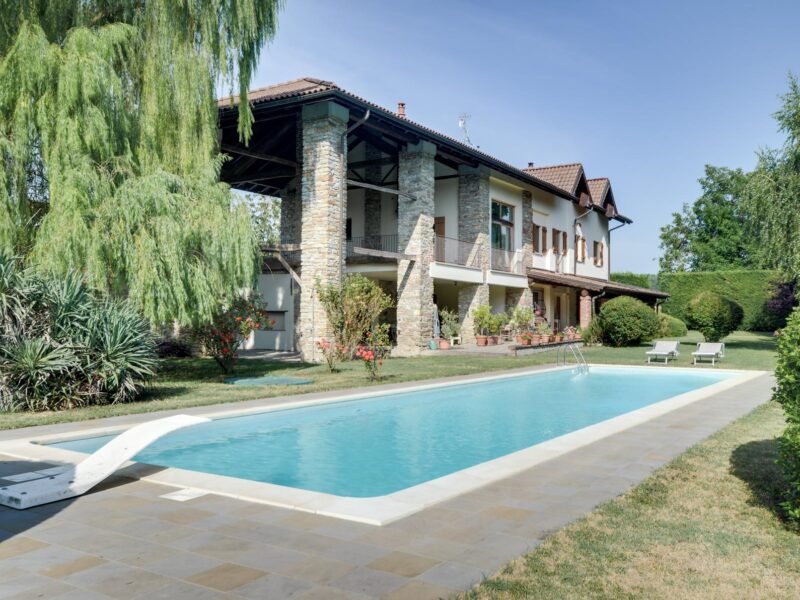 Elegant restored villa nestled in the rolling hills near Acqui Terme, surrounded by lush greenery and a serene private park