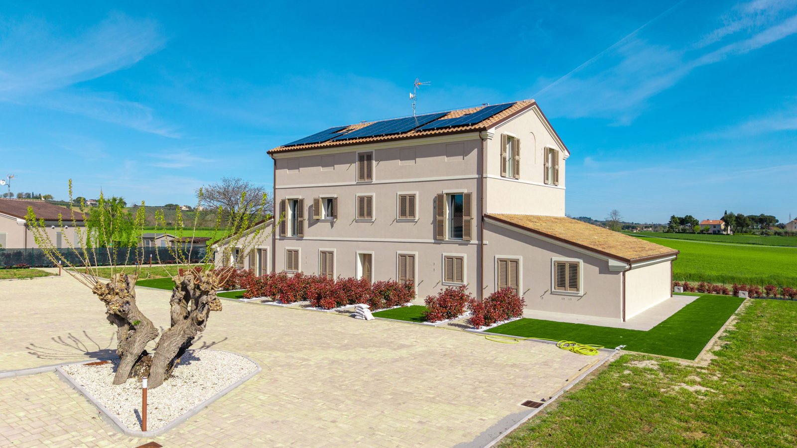 Eco-friendly country house with apartments and wellness suites in Monsano by Italian Hillside