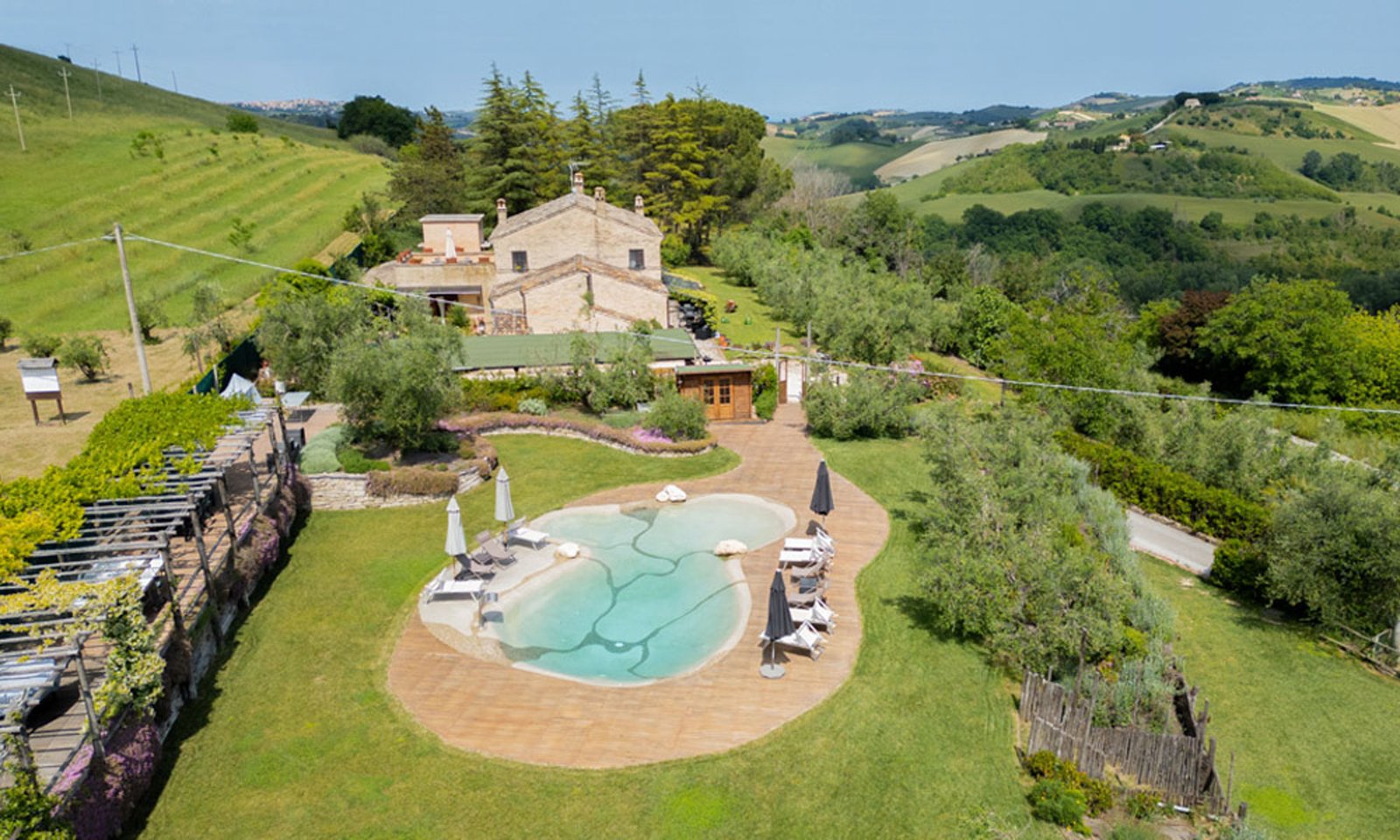 Restored farmhouse with pool and olive grove for sale near Fermo, Le Marche, Italy – Italian Hillside Real Estate