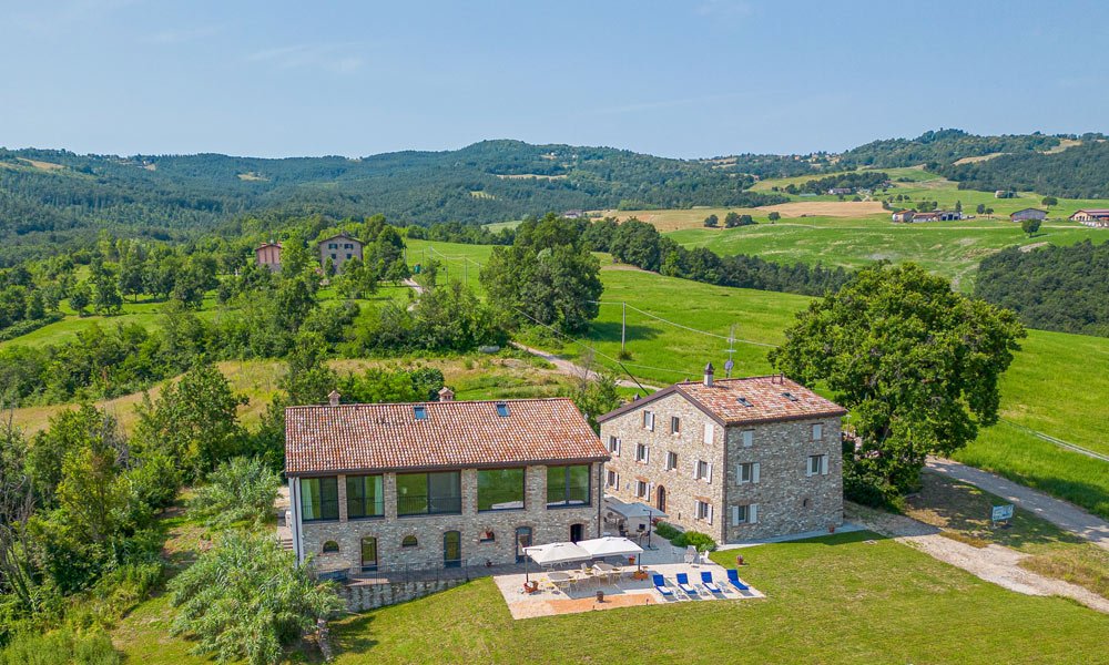 Luxury country estate with restored farmhouses and panoramic hills near Zocca, Emilia Romagna – Italian Hillside Real Estate